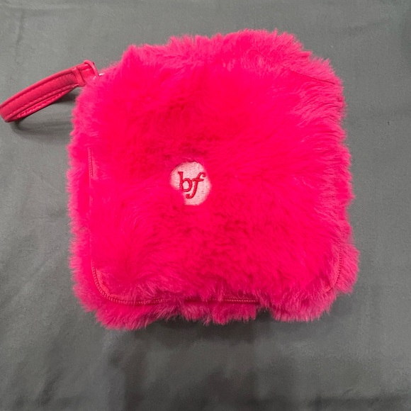 benifit cosmetics Handbags - Benefit cosmetics pink fluffy dice wristlet